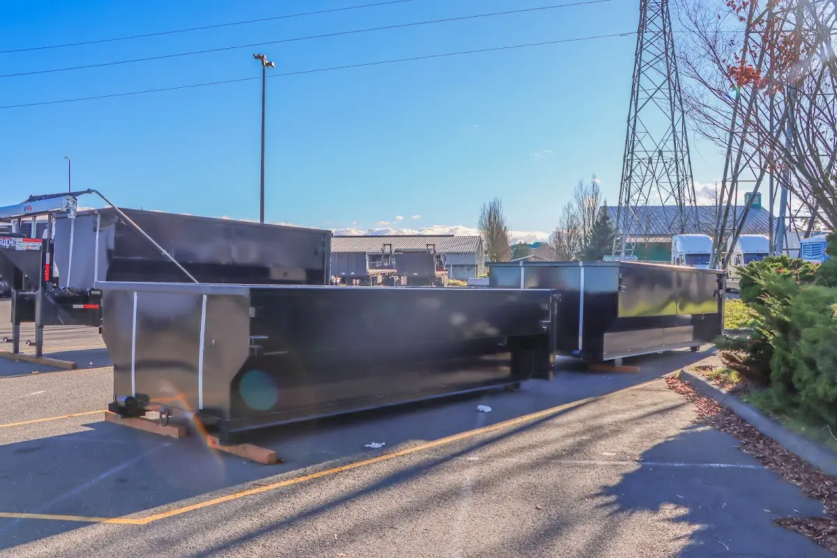 Roll-off dumpster ready for waste disposal at job site for Concrete Dumpster Rental in Manalapan